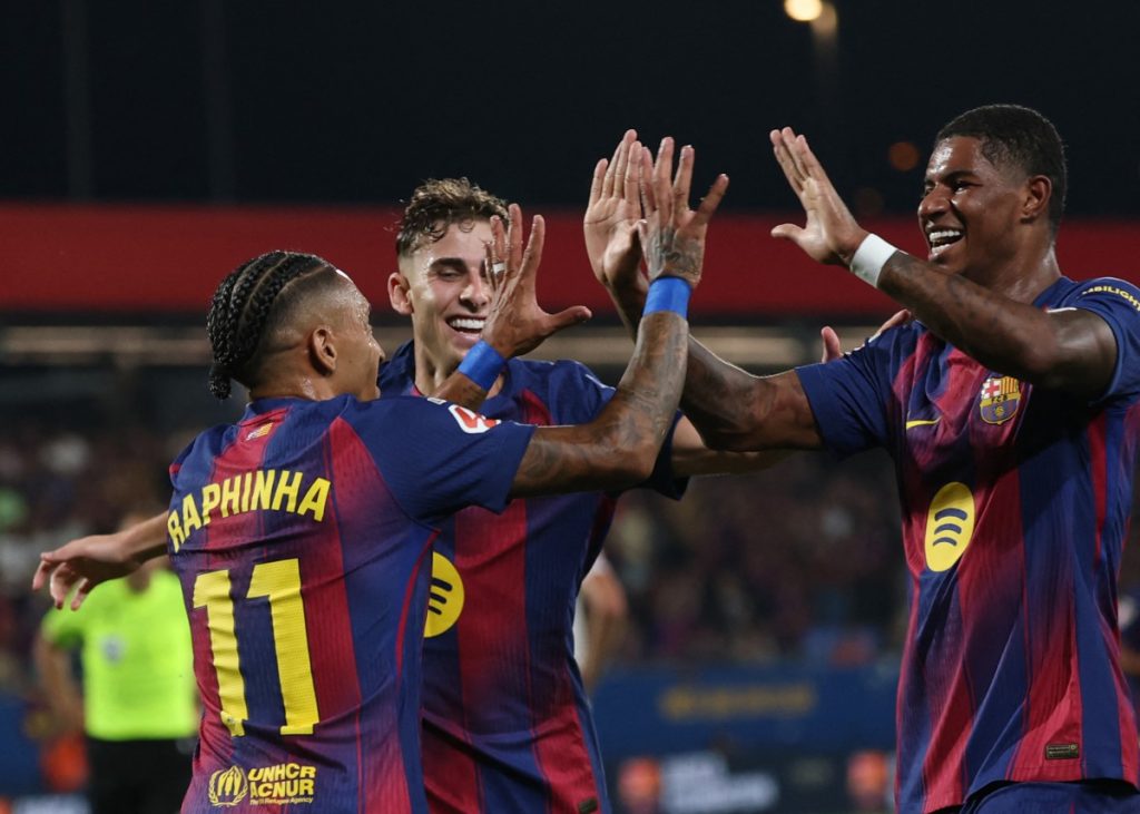 Champions Barca crush Valencia 6-0 in first home game