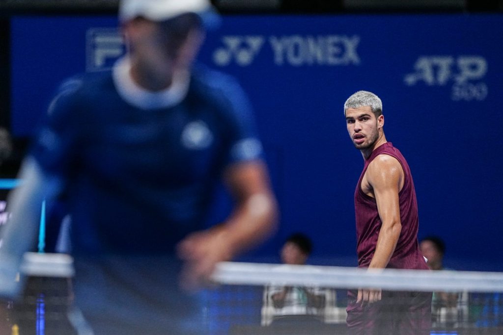 Alcaraz survives injury scare and rain delay to win Tokyo opener